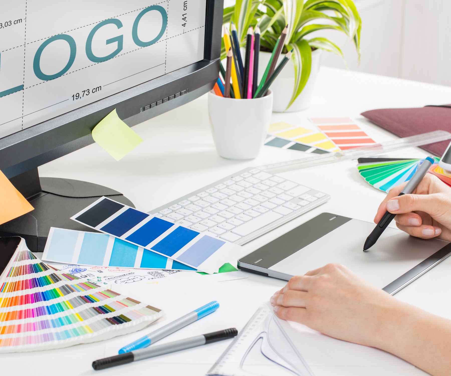 Professional graphic design workstation with color and layout tools