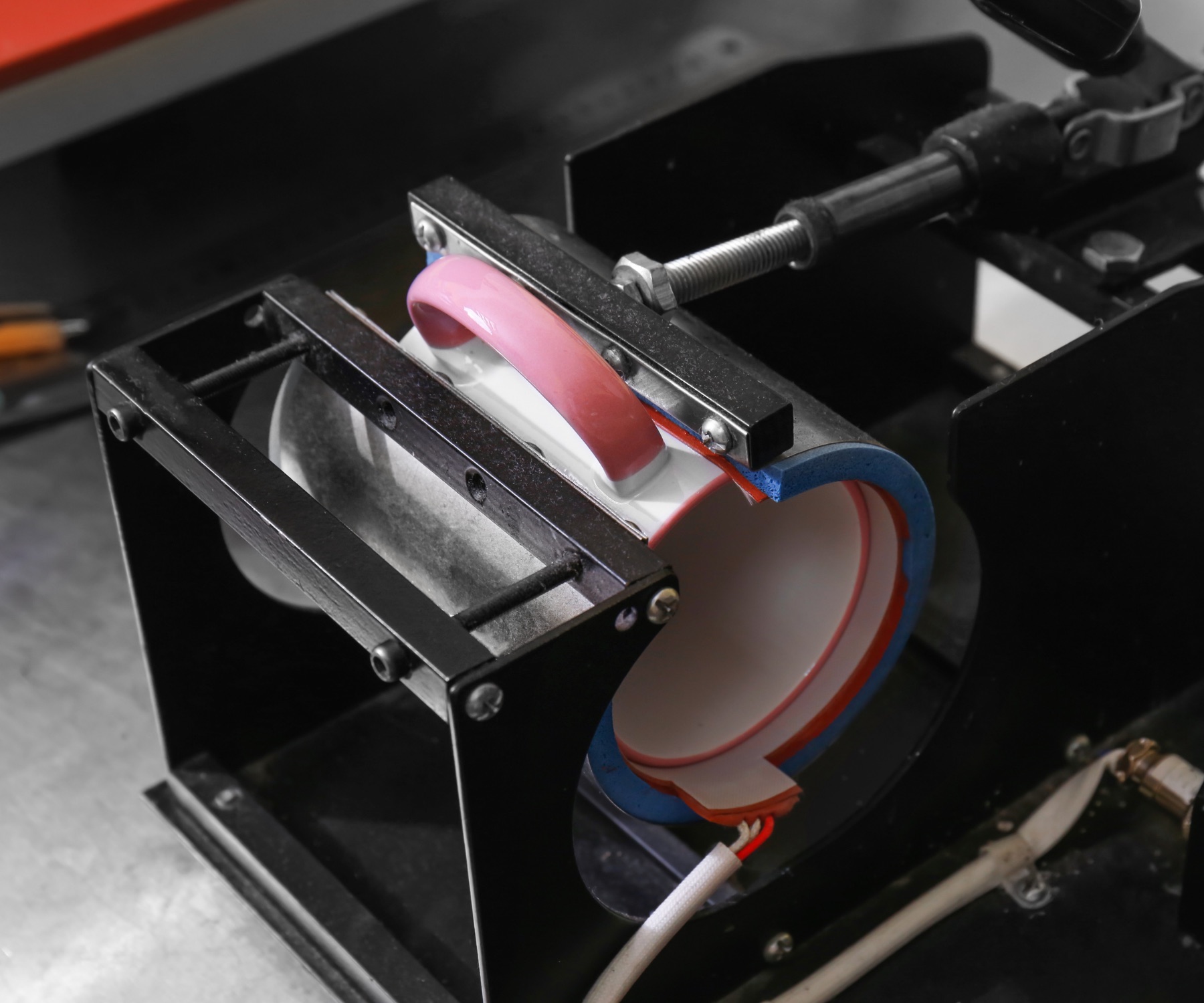 Custom printed mug in production